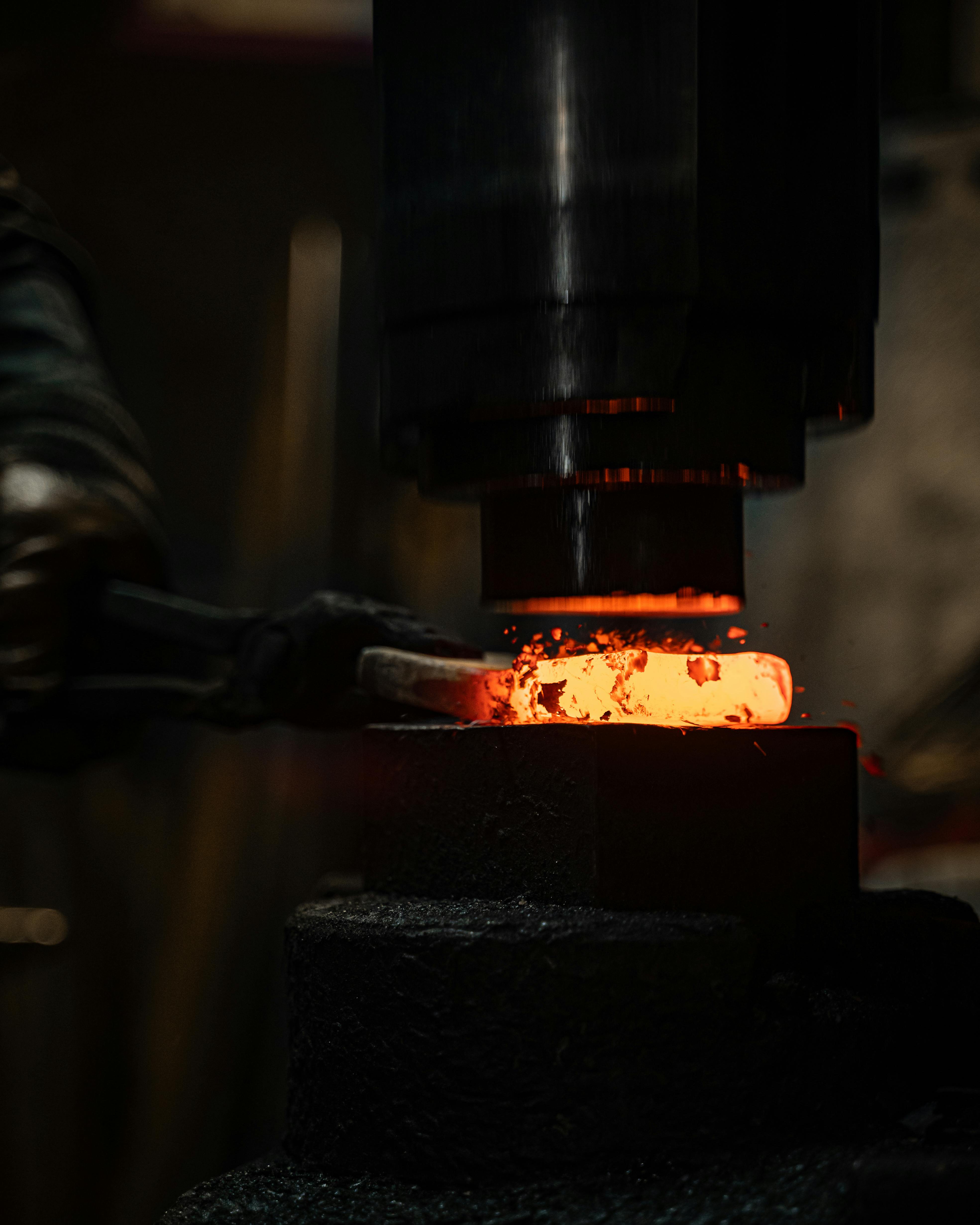 Iron being shaped under pressure